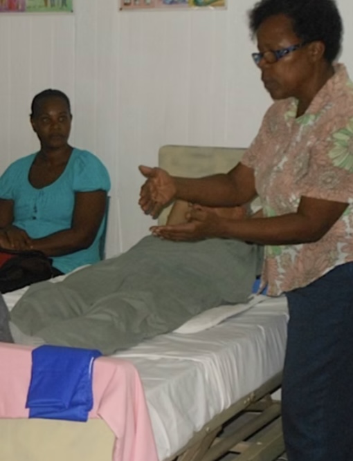 Liberty Nursing instructor demonstrating bedside care