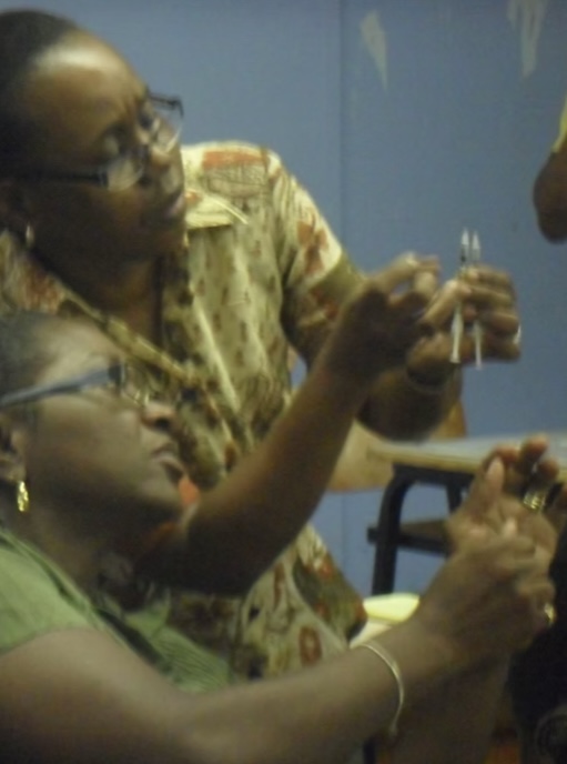 Trainees practising injection technique during a Liberty Nursing course